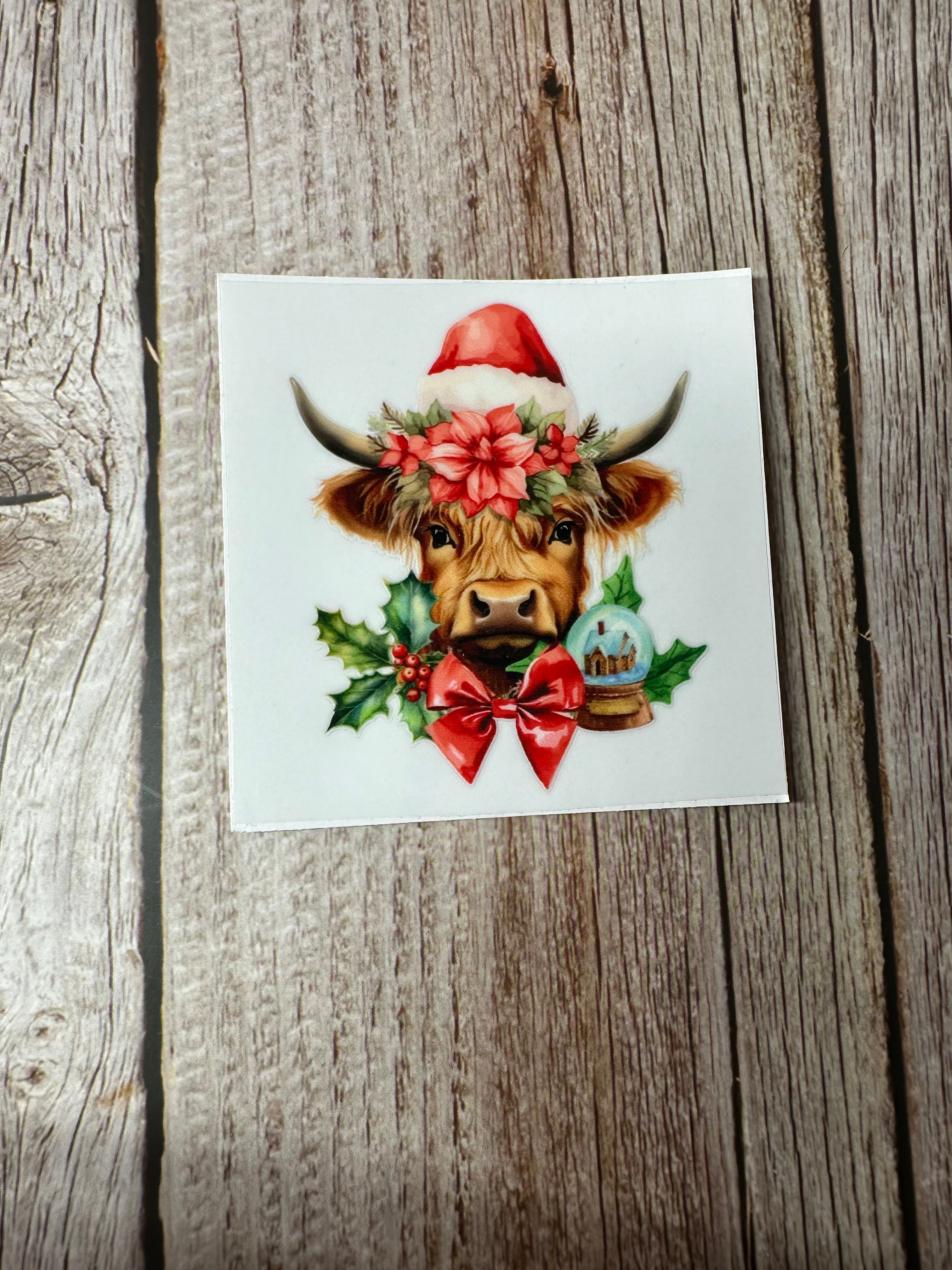 Christmas cow snow globe